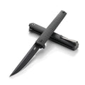 Black folding knife on a white background