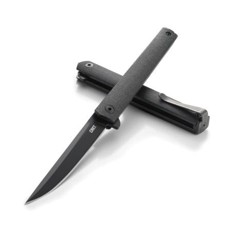 Black folding knife on a white background