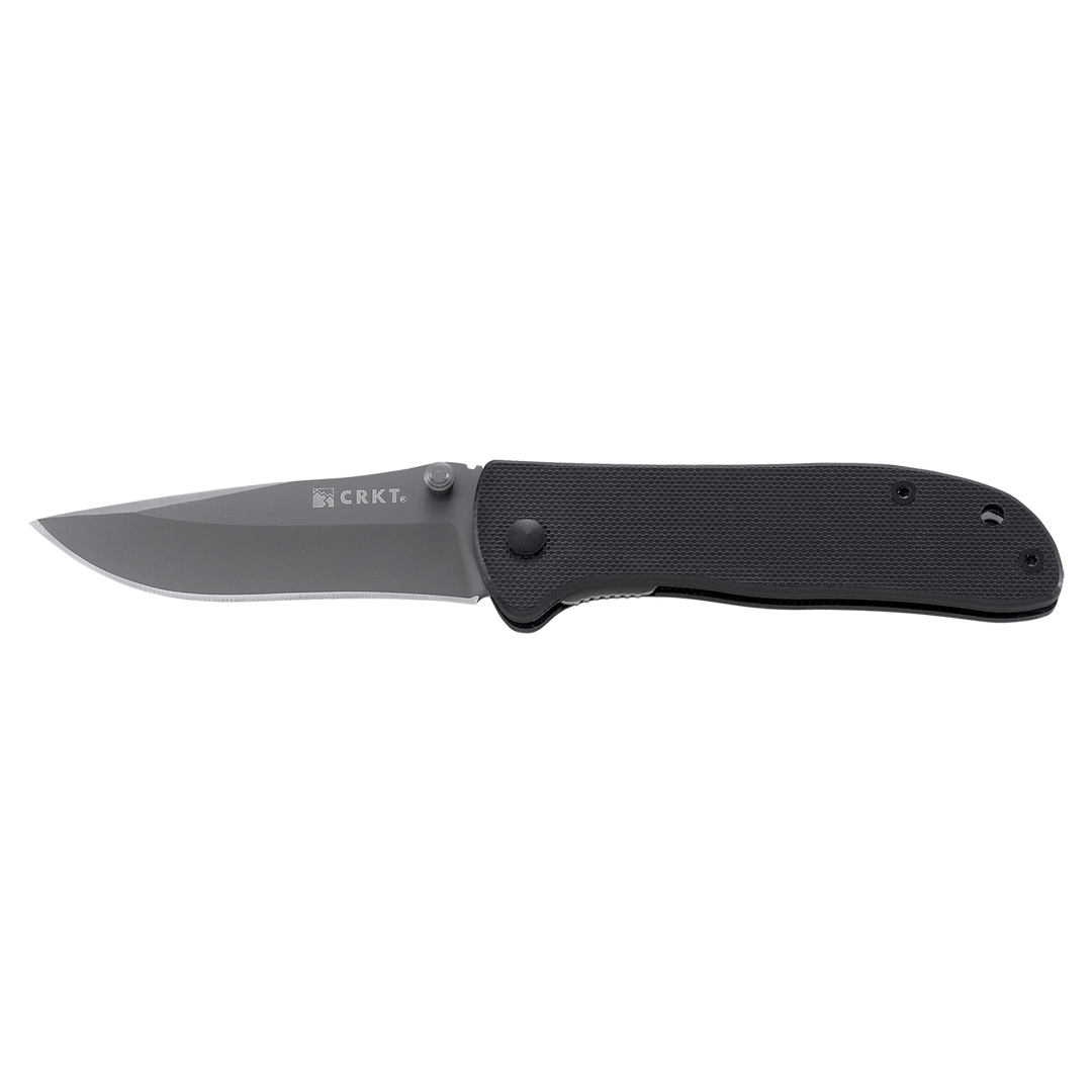 Folding knife with black handle and silver blade on a white background